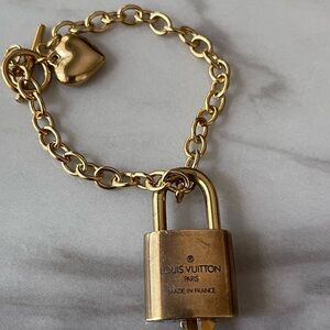 Louis Vuitton Gold Padlock with Gold Chain.